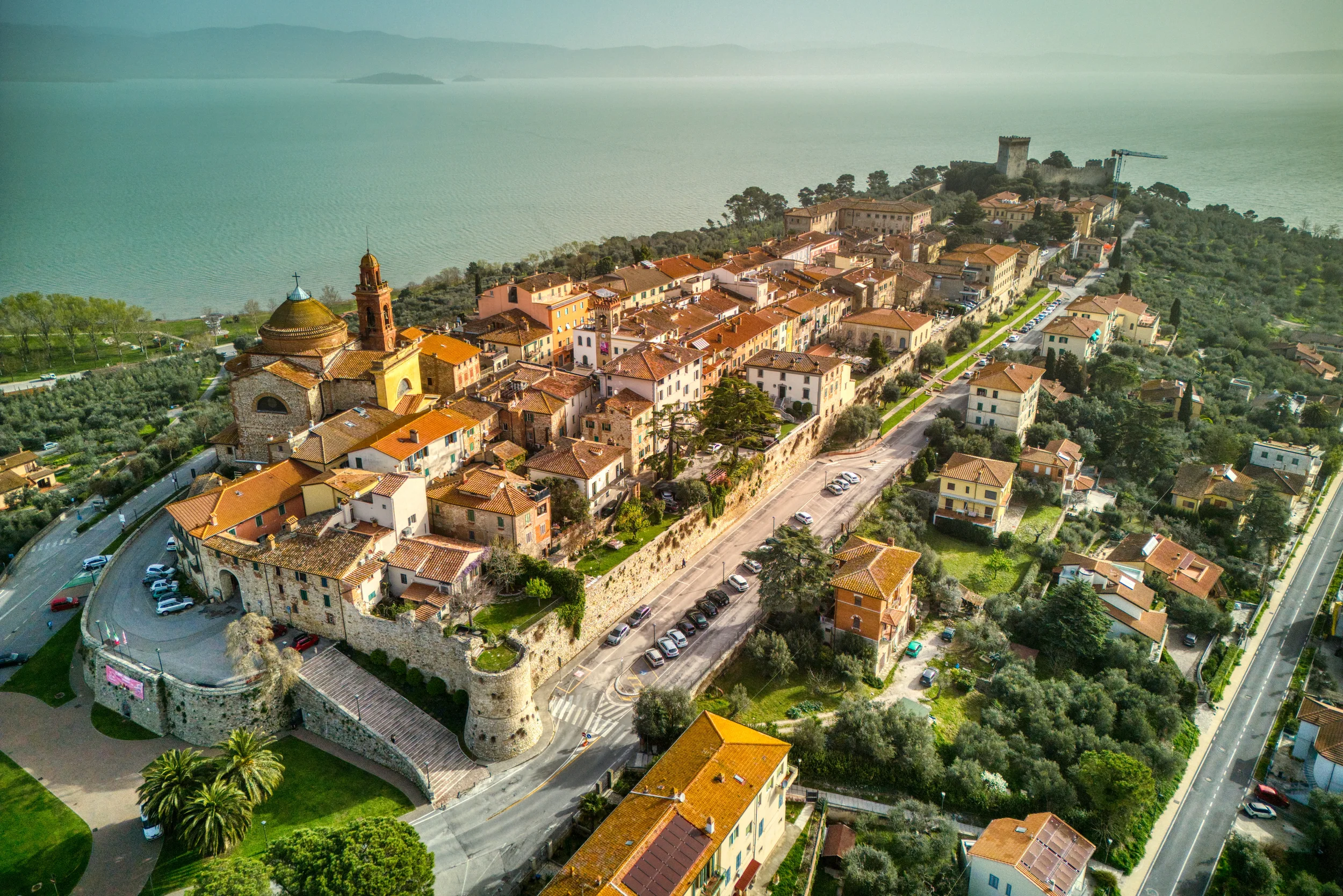 Aerial view of the walled old town of Castiglione del Lago beside Lake Trasimeno