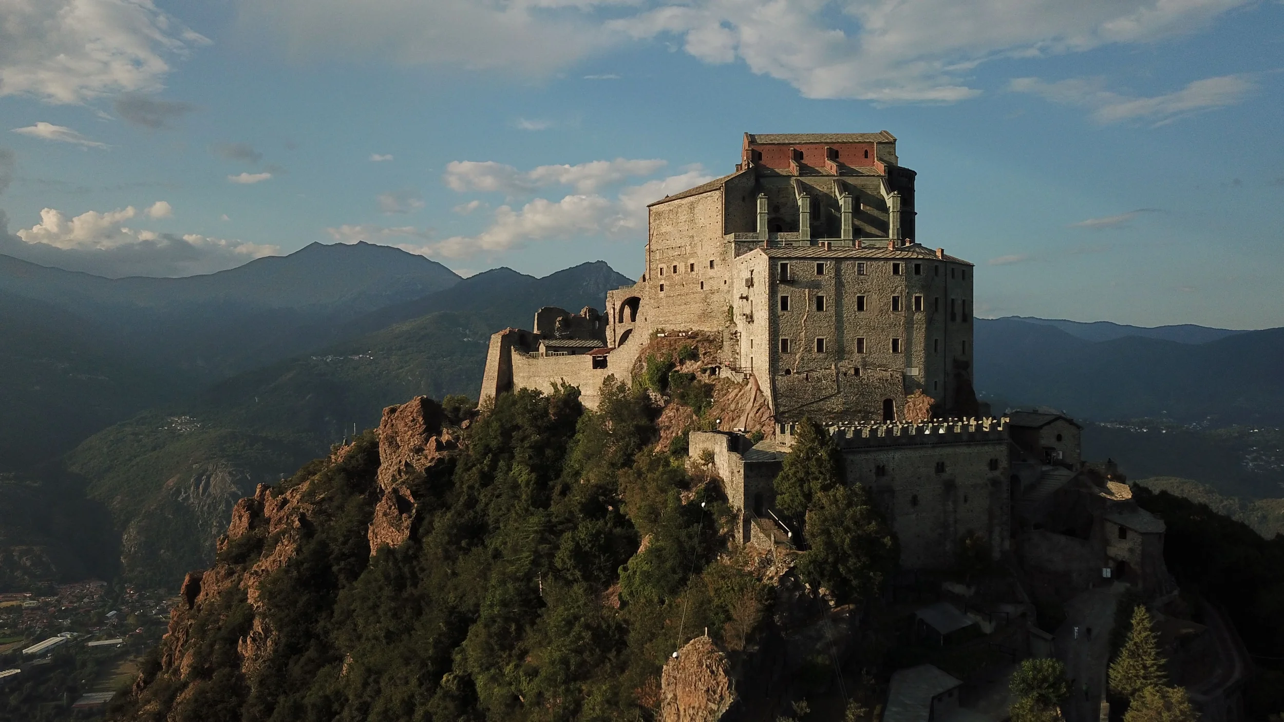 Sacra di San Michele abbey on a rocky mountaintop above the Susa Valley in Piemonte, Italy.