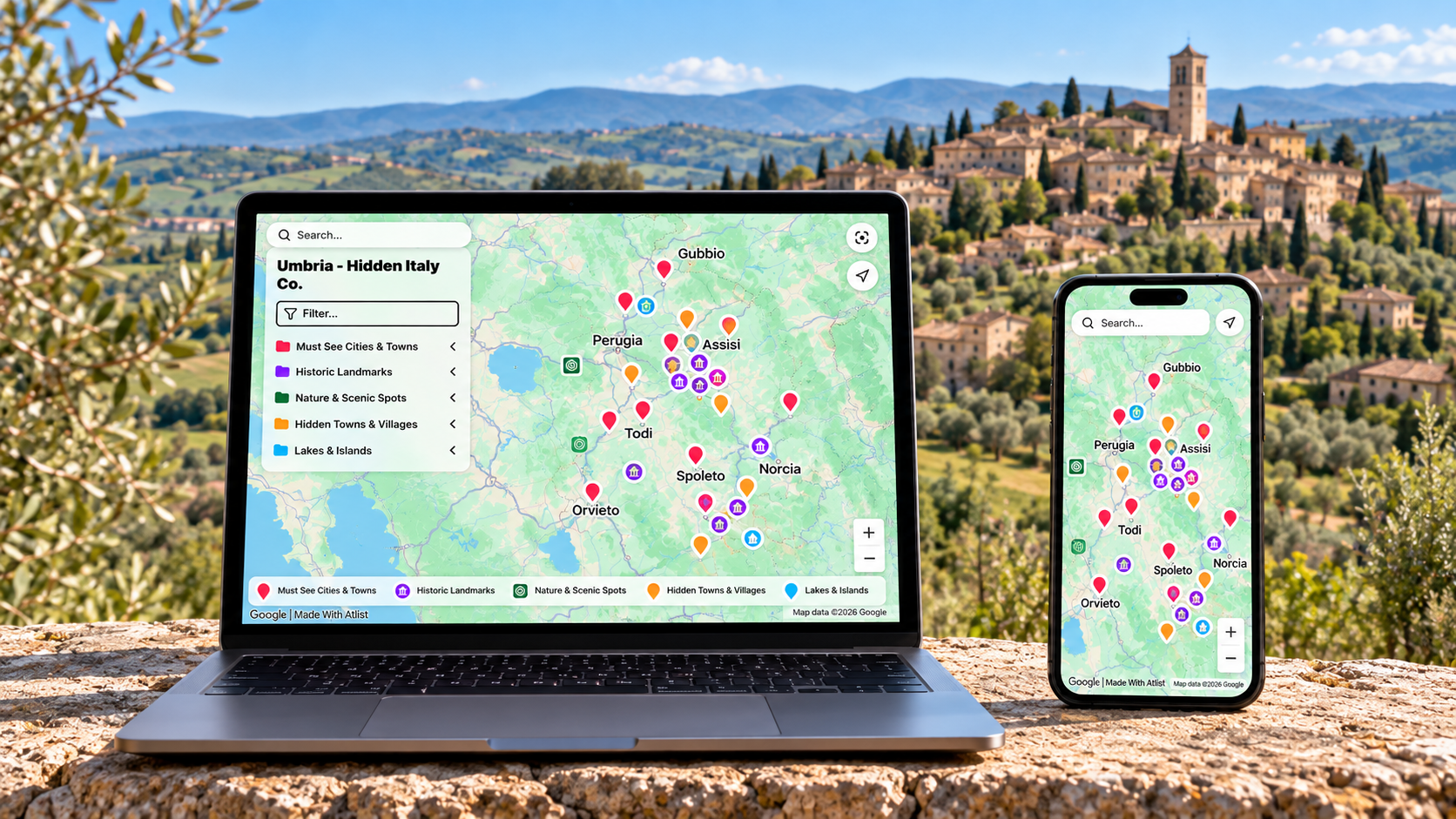 Hidden Italy Umbria travel map with English category labels displayed on a laptop and smartphone