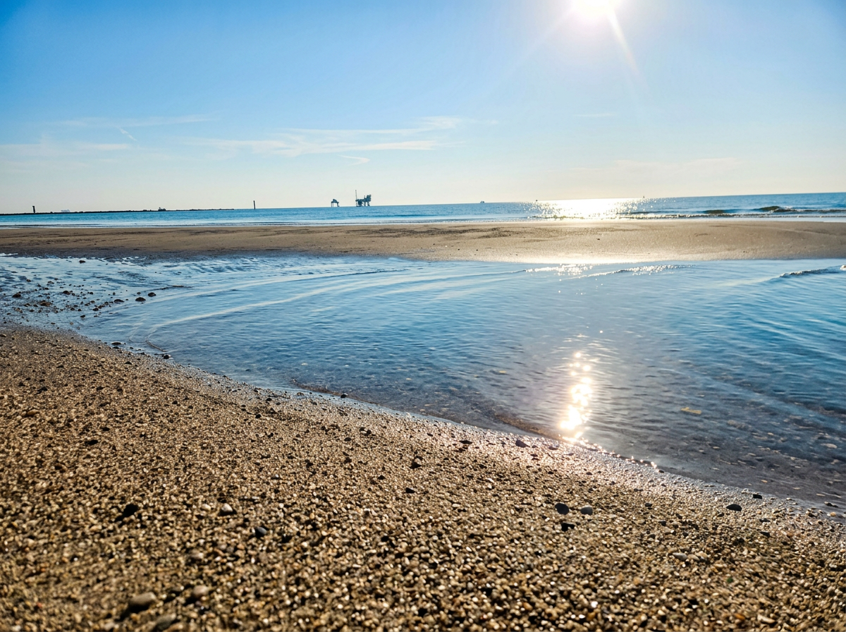 Wild sandy beach and shallow Adriatic water at Spiaggia della Bassona near Ravenna