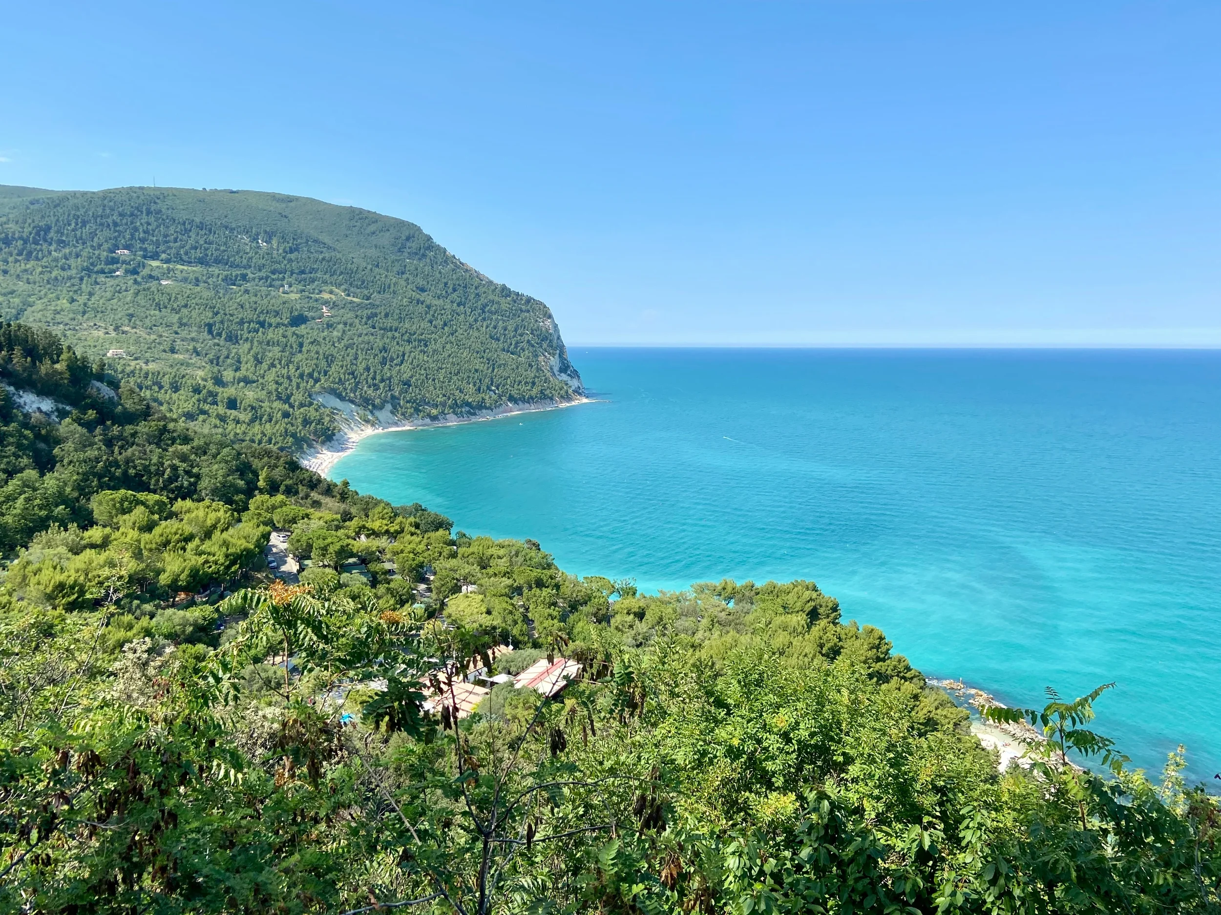 Turquoise Adriatic Sea and forested cliffs of Monte Conero along the coastline of Le Marche, Italy