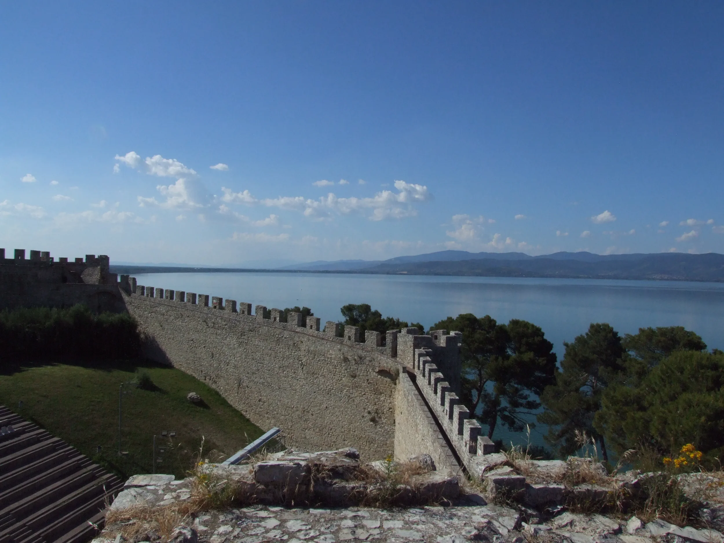 Crenellated walls of Rocca del Leone overlooking Lake Trasimeno in Castiglione del Lago