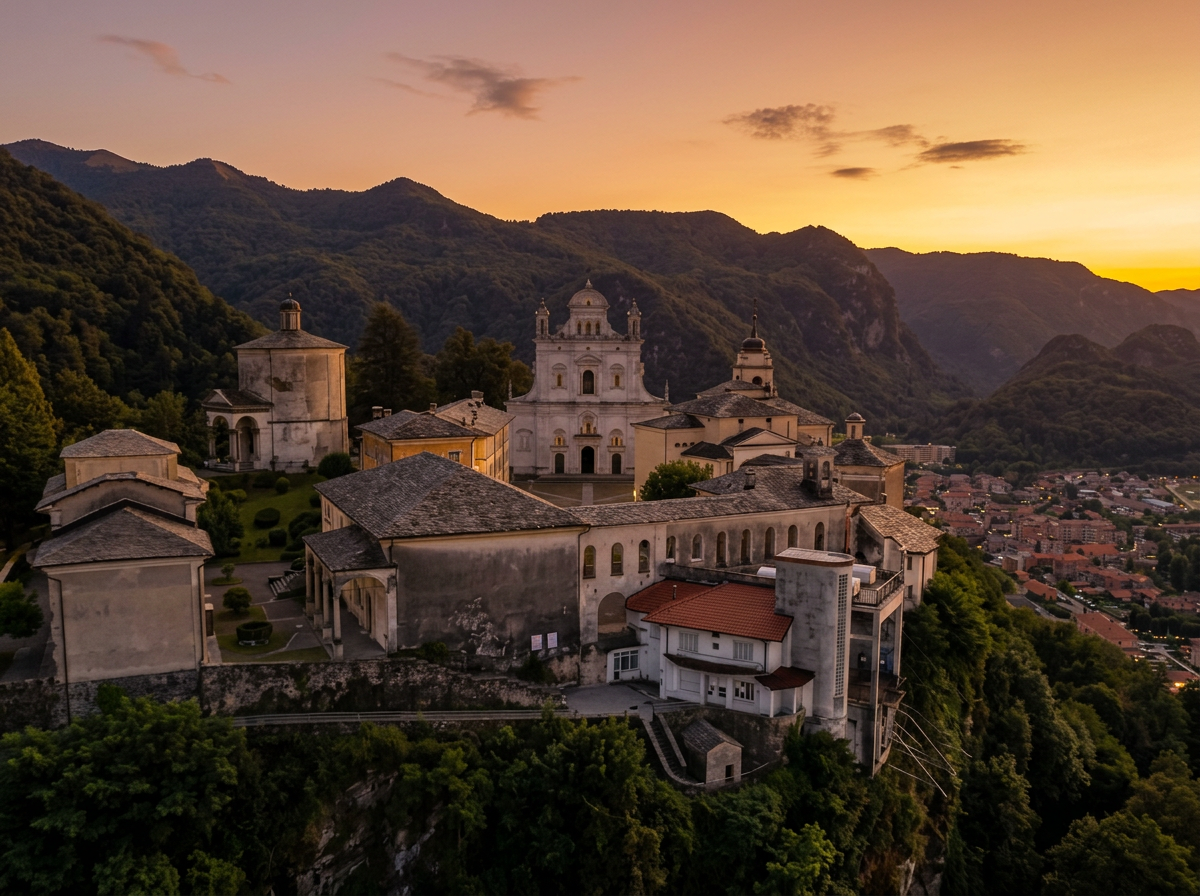 Basilica and chapels of Sacro Monte di Varallo above the town at sunset, Piedmont