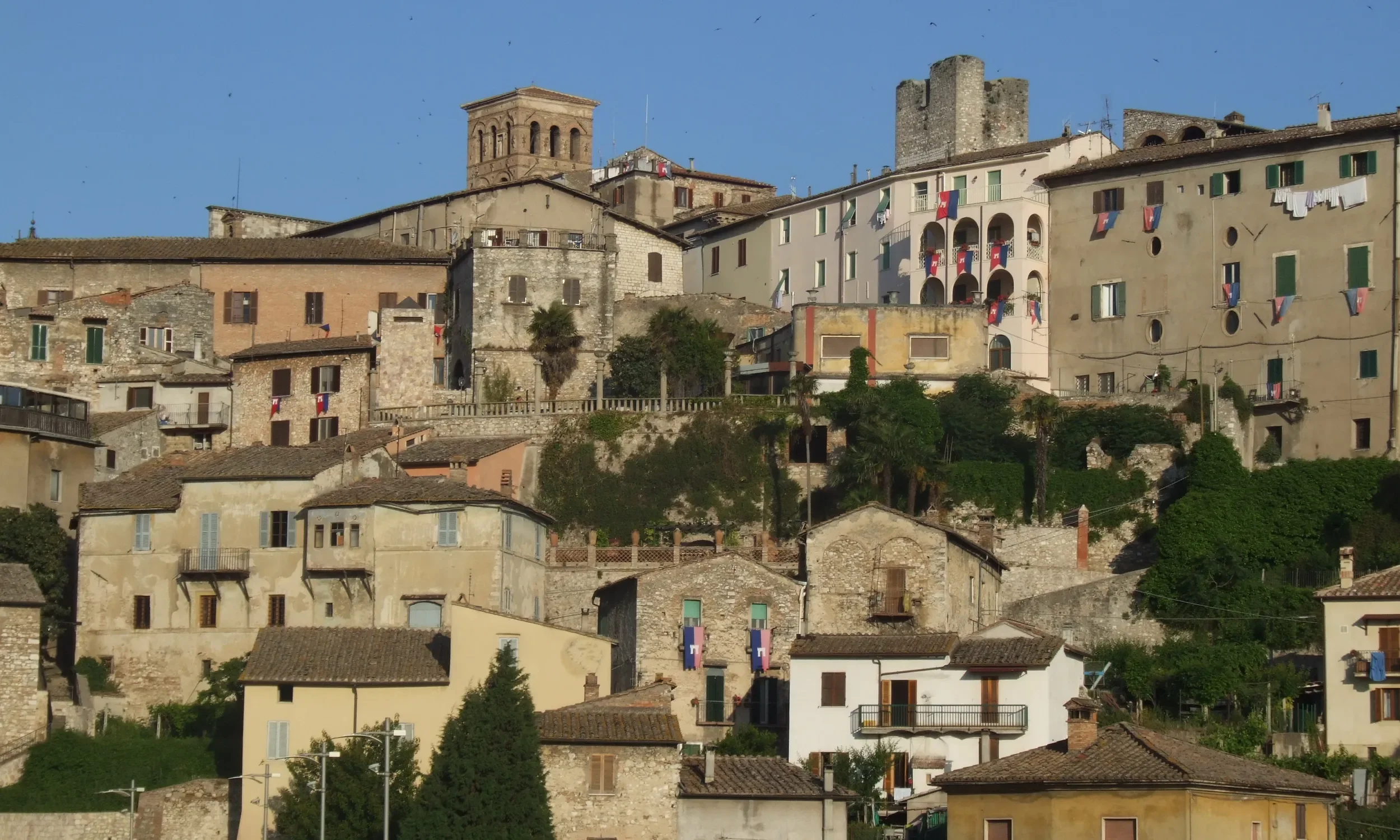 Stone houses, civic buildings and towers on the hillside of Narni’s historic centre