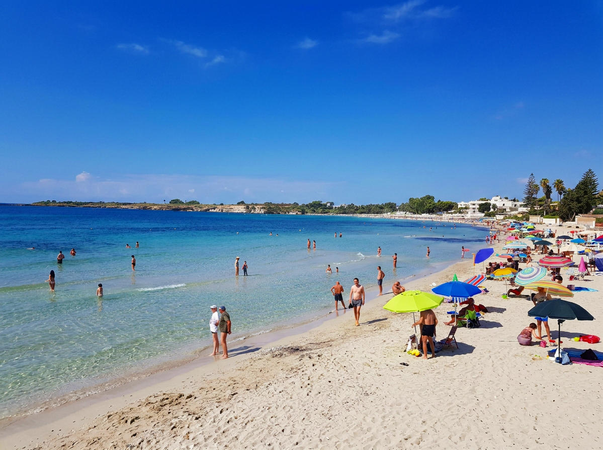 White sandy beach and clear turquoise water at Fontane Bianche near Syracuse, Sicily, Italy.