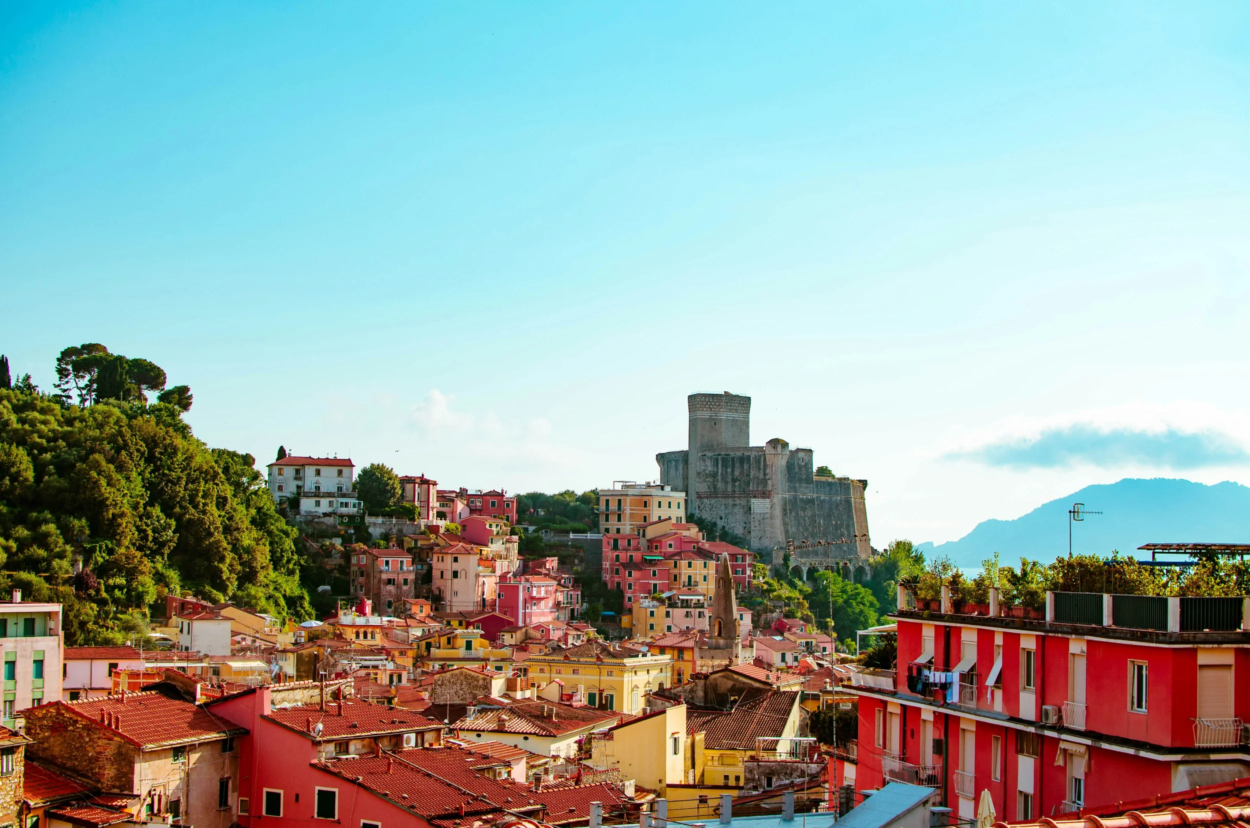 Lerici Castle rising above colourful rooftops on the Gulf of Poets in Liguria