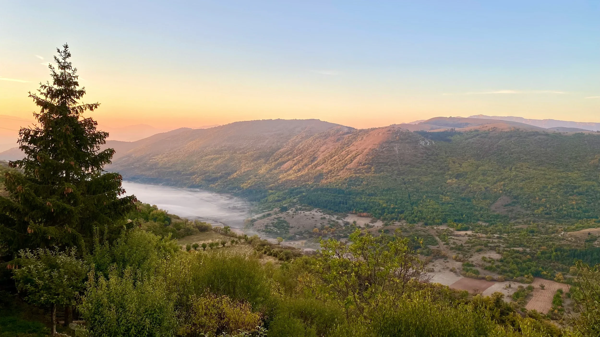Morning light and mist over the mountain valley near Santo Stefano di Sessanio, Abruzzo.