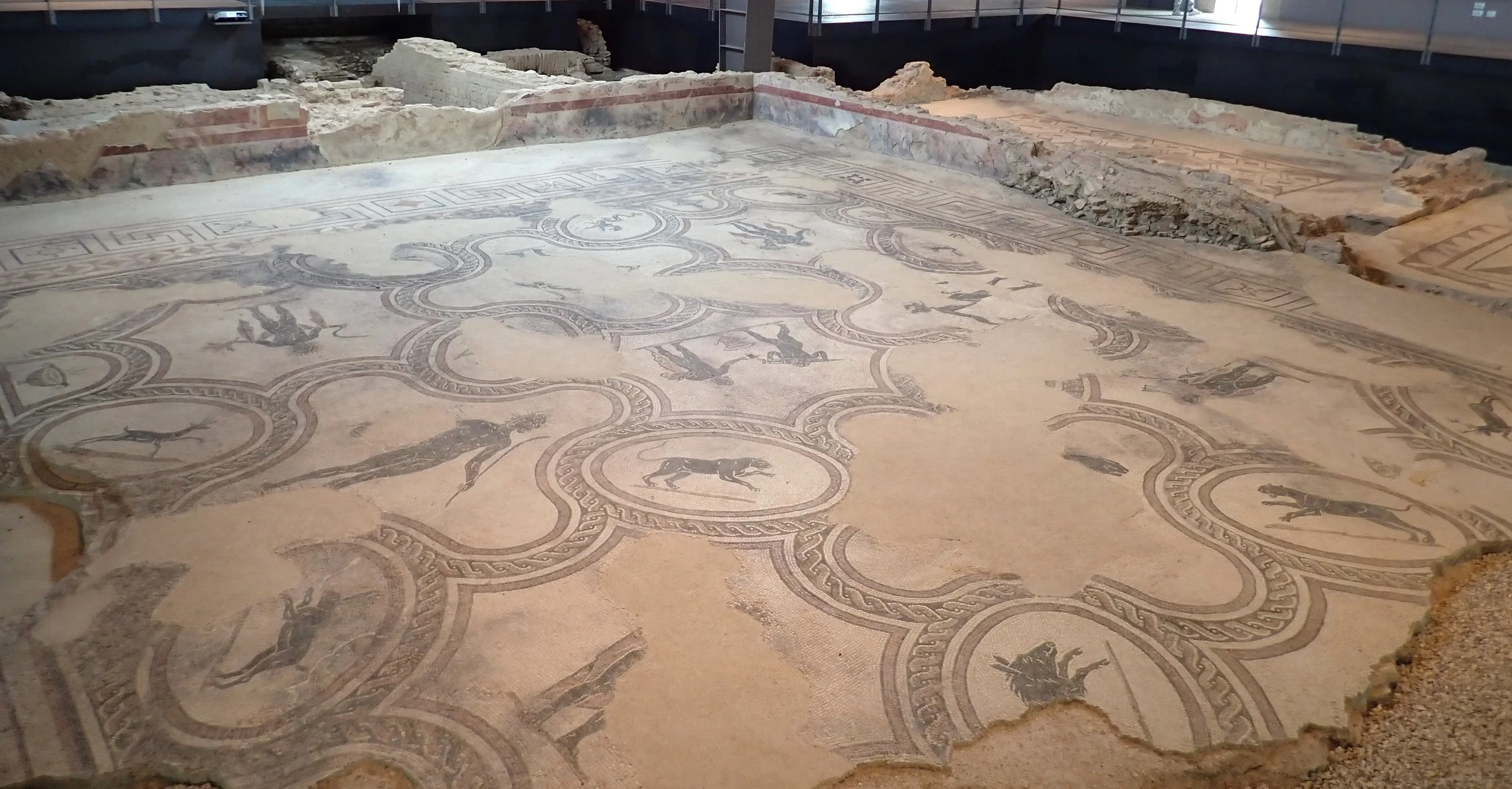 Roman mosaic floor with geometric borders and animal figures at the Villa dei Mosaici in Spello