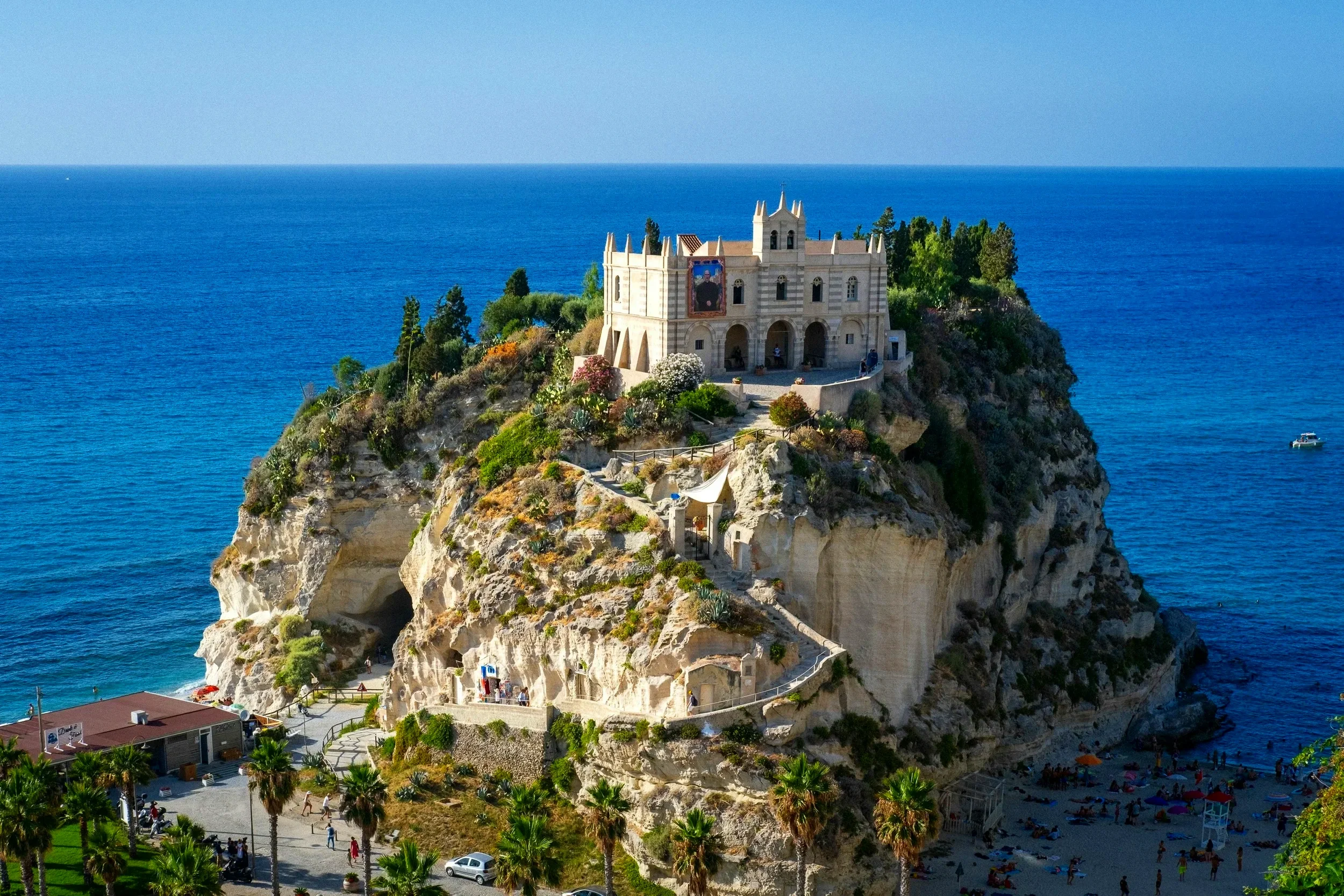 Dramatic coastal cliffs and turquoise sea near Tropea in Calabria, Italy