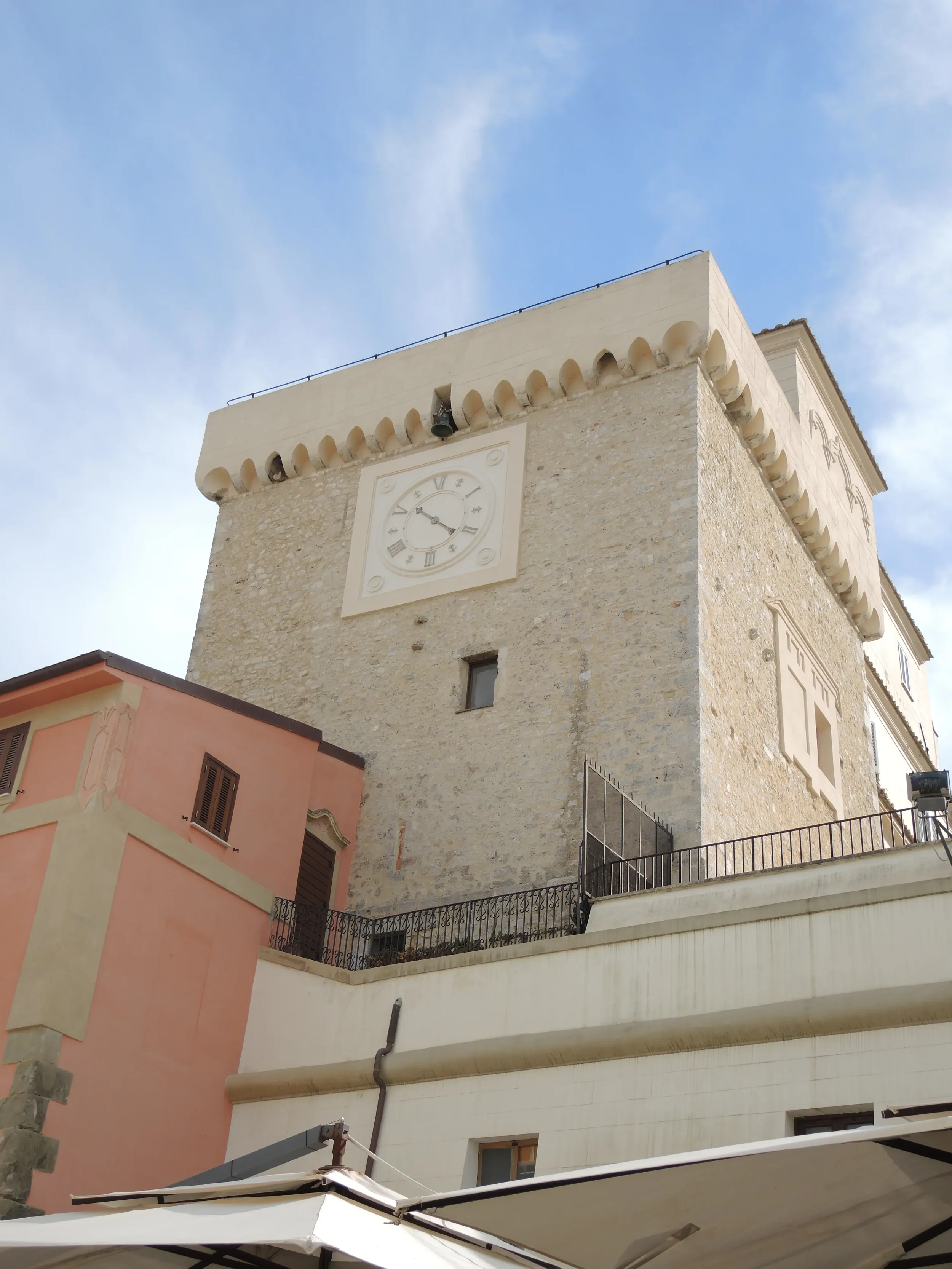 The stone Torre dei Templari and its clock above the square in San Felice Circeo.