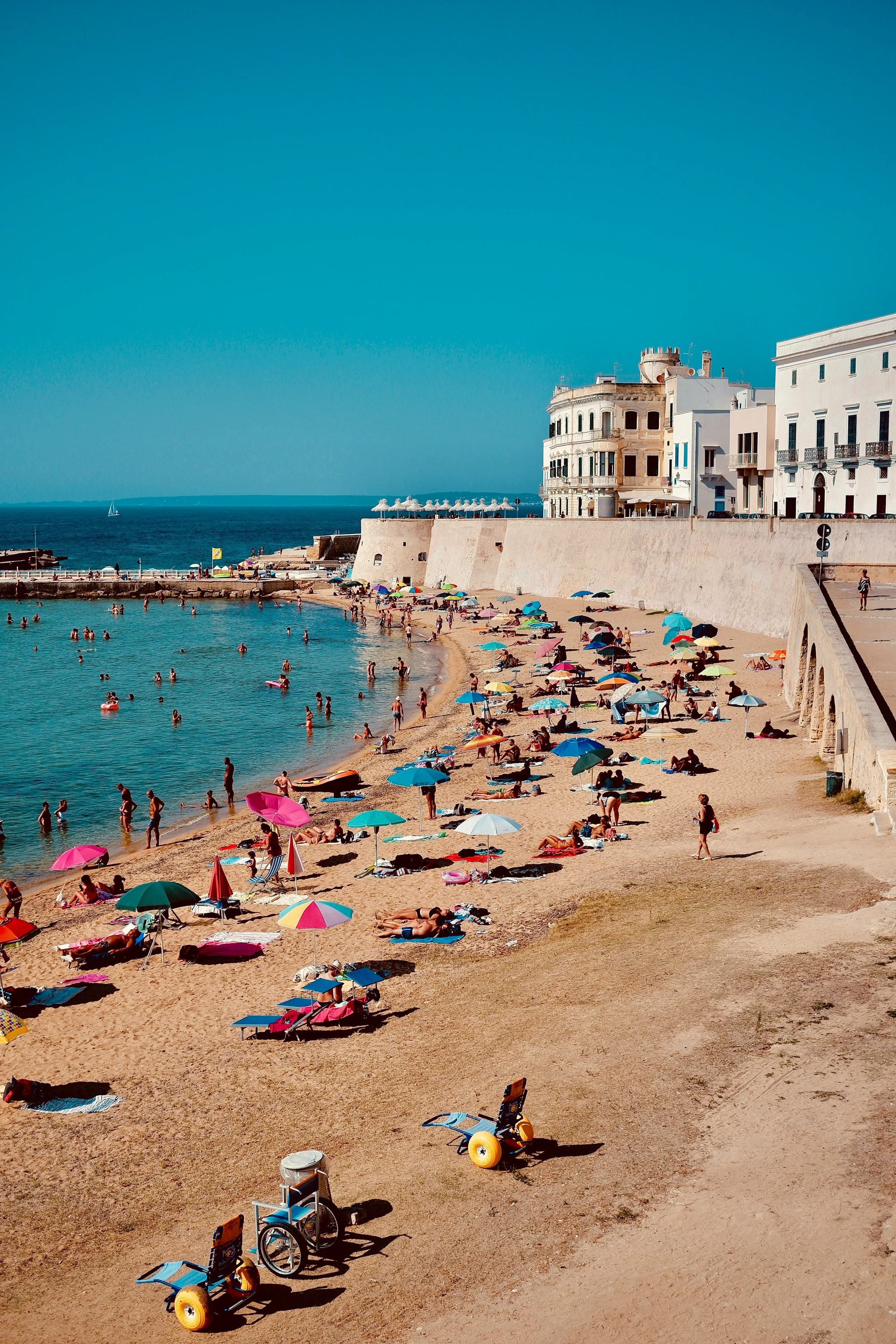 Beach beside the historic old town of Gallipoli on the Ionian coast of Puglia, Italy