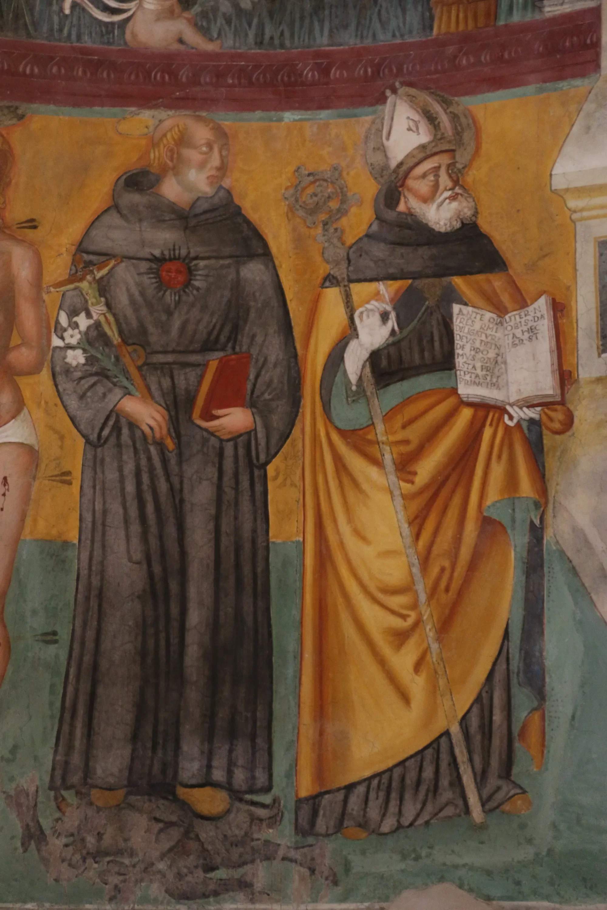 Fresco of two saints, one holding an open book, in Santa Illuminata church in Montefalco