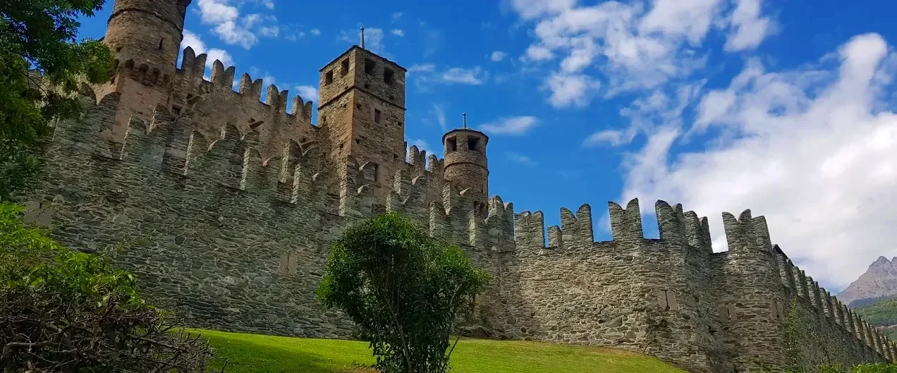 Medieval towers and fortified walls of Fénis Castle in Valle d’Aosta, Italy