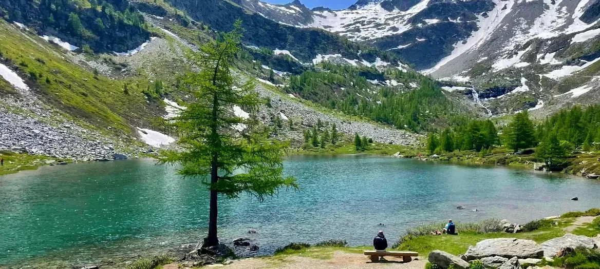 Lago d’Arpy surrounded by Alpine mountains in Valle d’Aosta, Italy