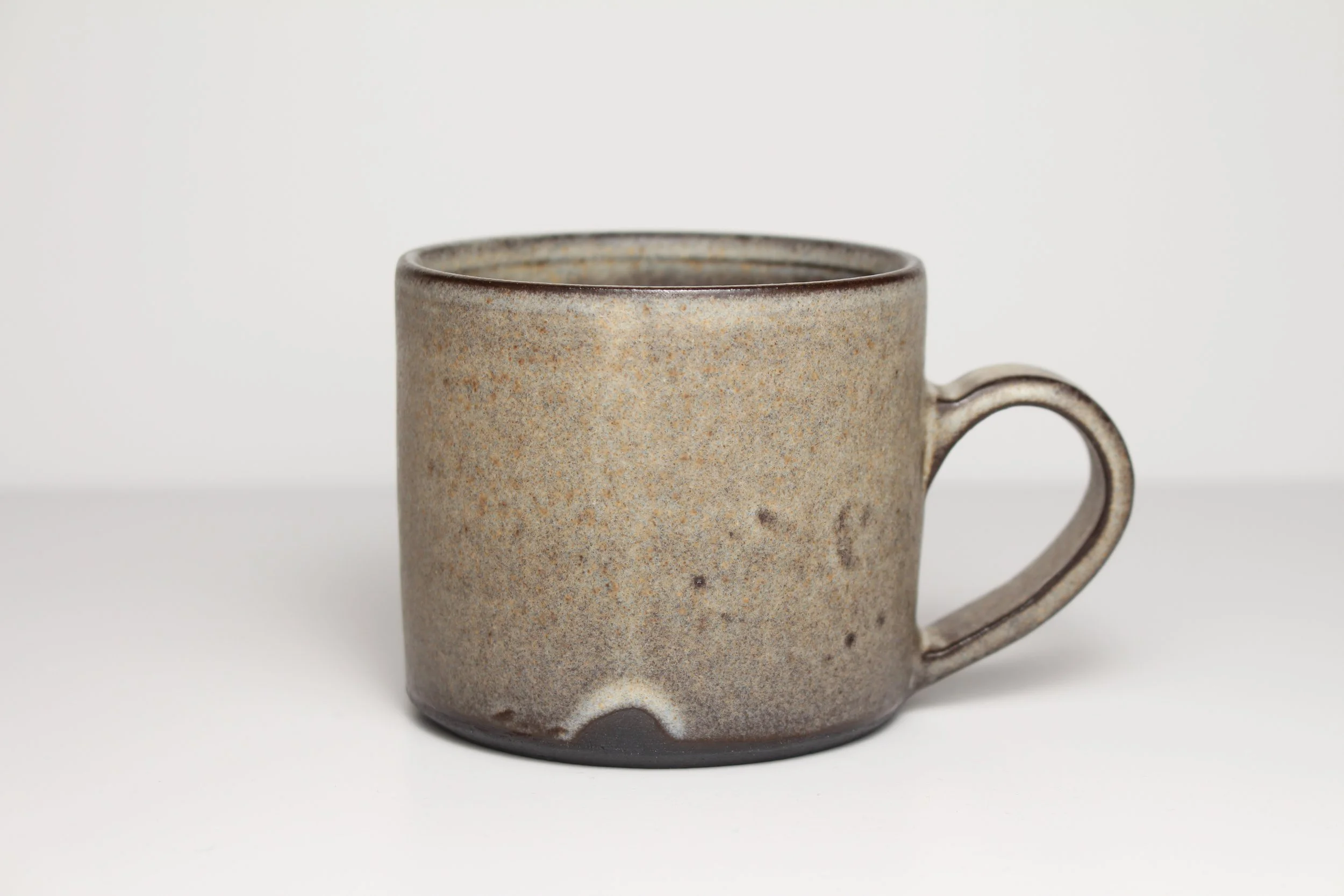 Black mug with creme glaze