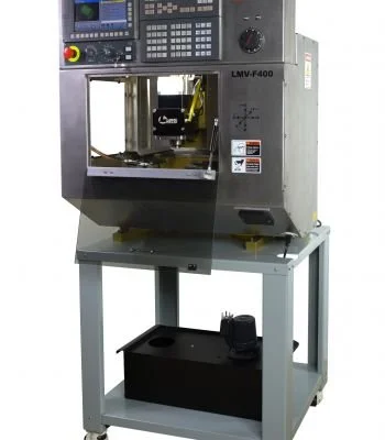 Industrial CNC milling machine with control panel and work table