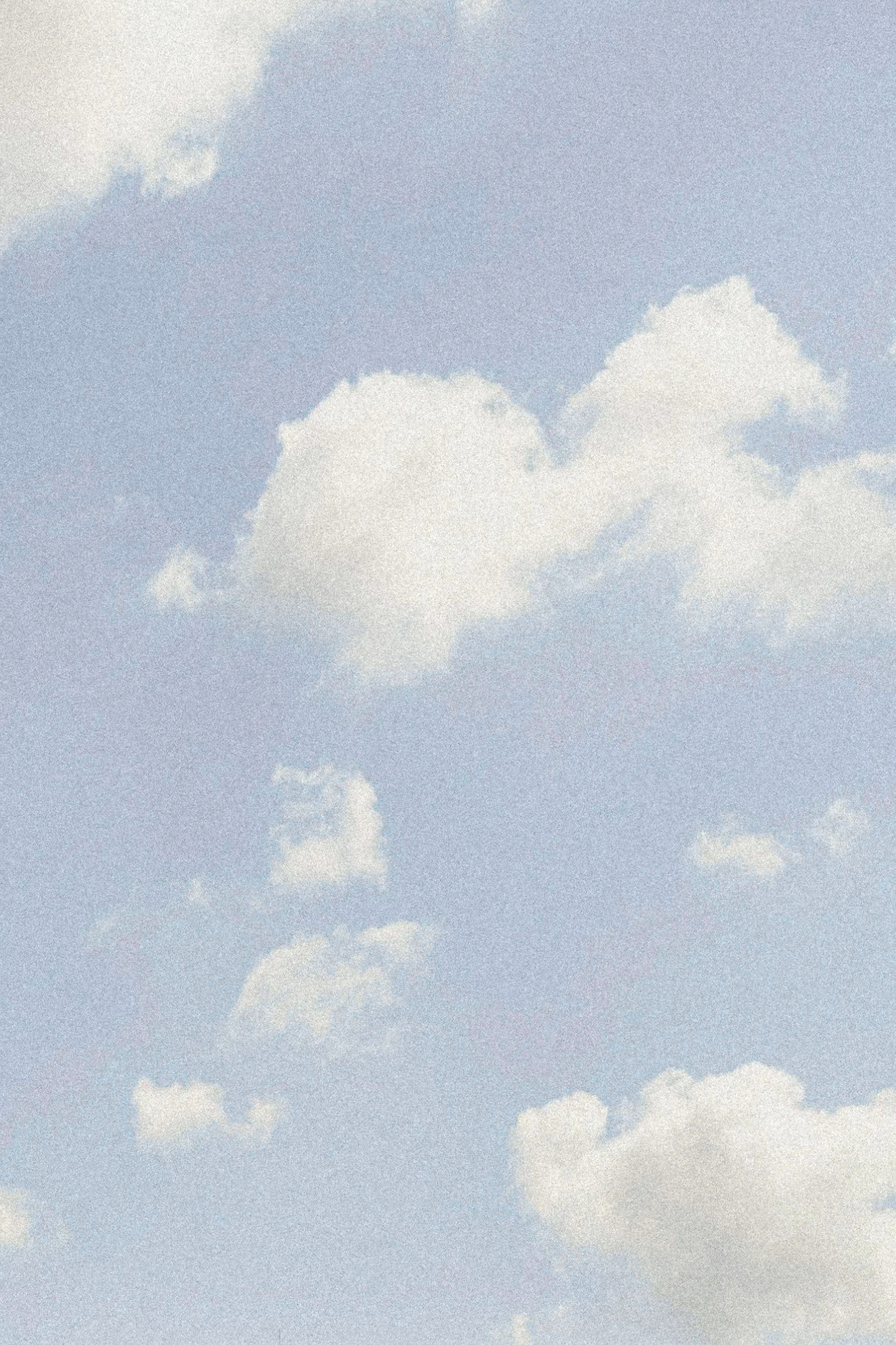 Blue sky with white fluffy clouds.