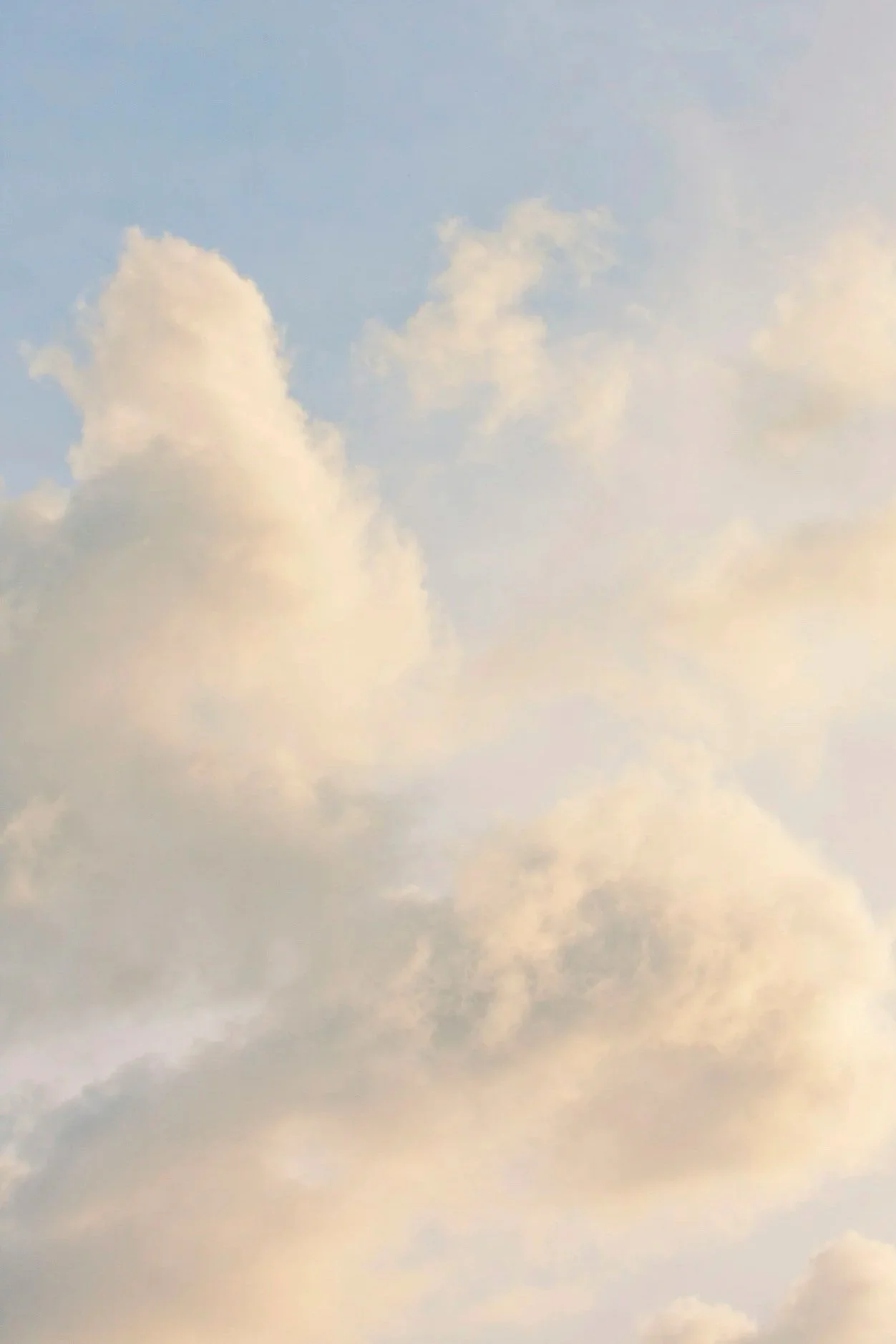 Sky with scattered clouds at sunset or sunrise