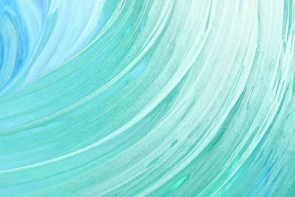 Tinte di colore verde acqua e blu creano un effetto di pennellate curve su una superficie