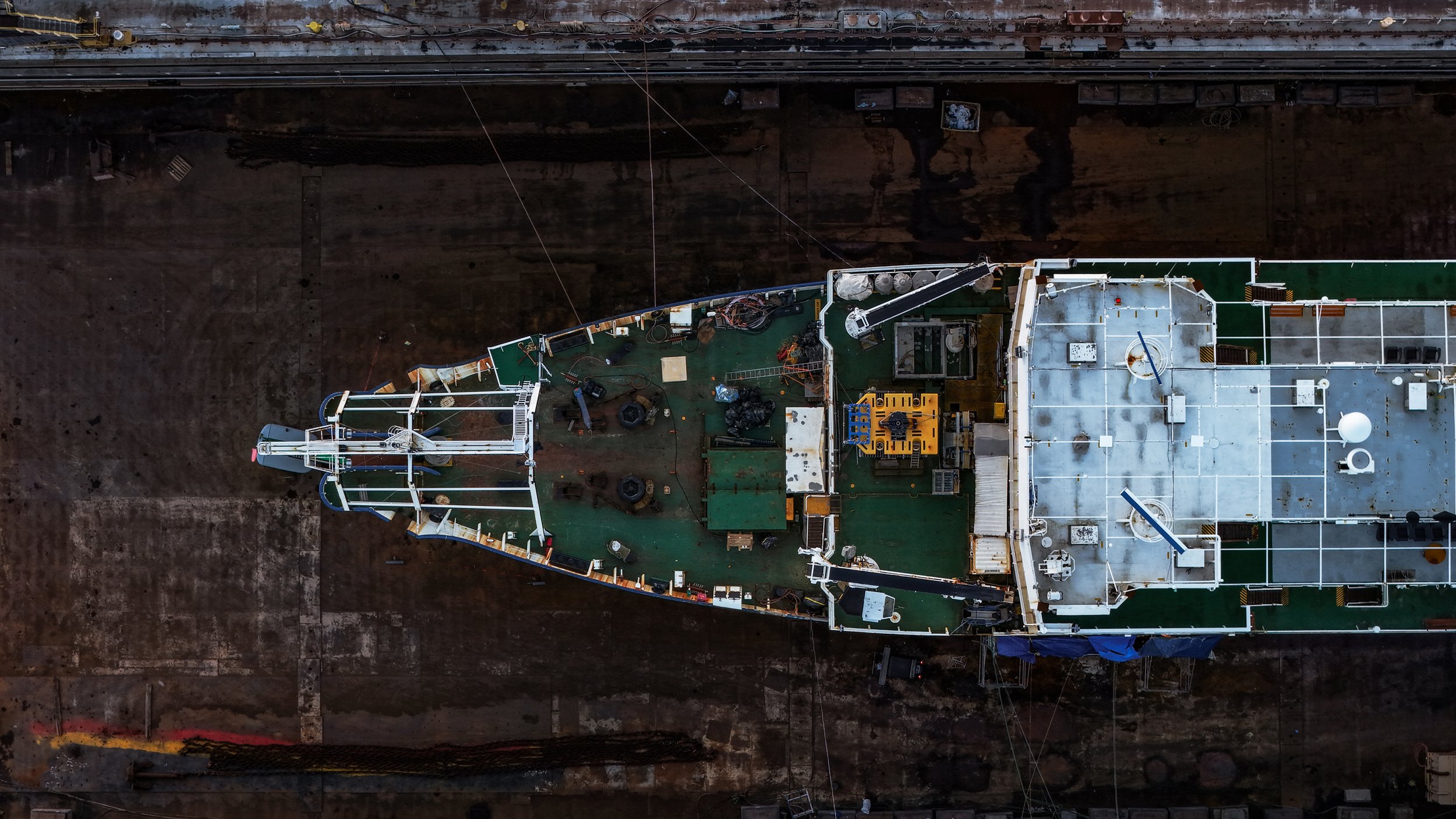 Intrepid on dry dock shot overhead, moody cinematic