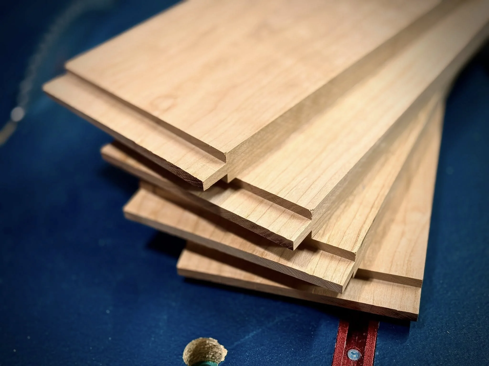 Stack of milled boards with carved tenons.