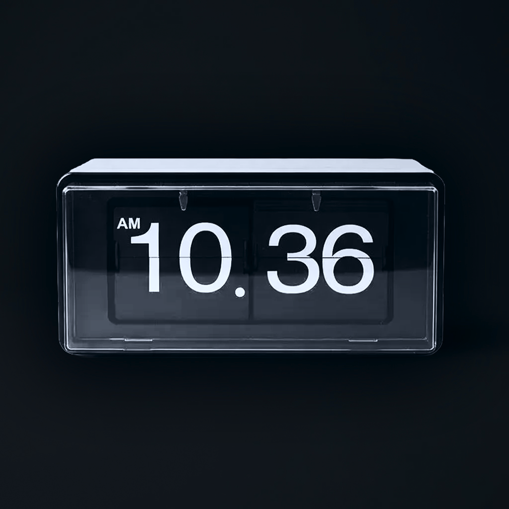 A digital flip clock displaying 10:36 AM against a dark background BigStoryShort