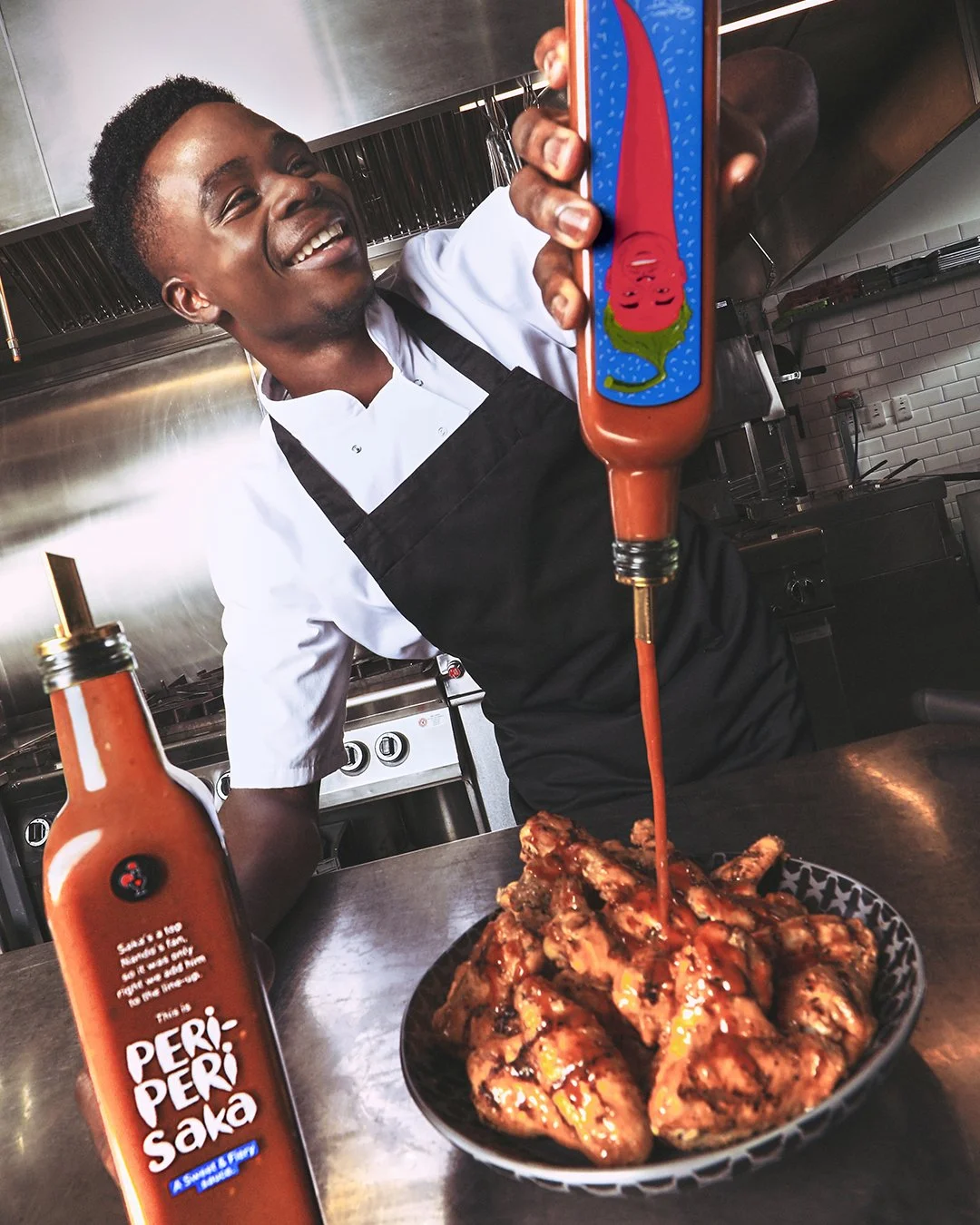 65f9676aca640b34e4d5e28c_Nando_s PERi-PERi Saka_Bottle Pour copy.JPG