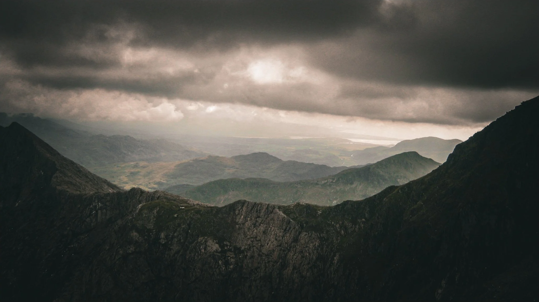 Summit+view%2C+light+breaking+through+cloud.png