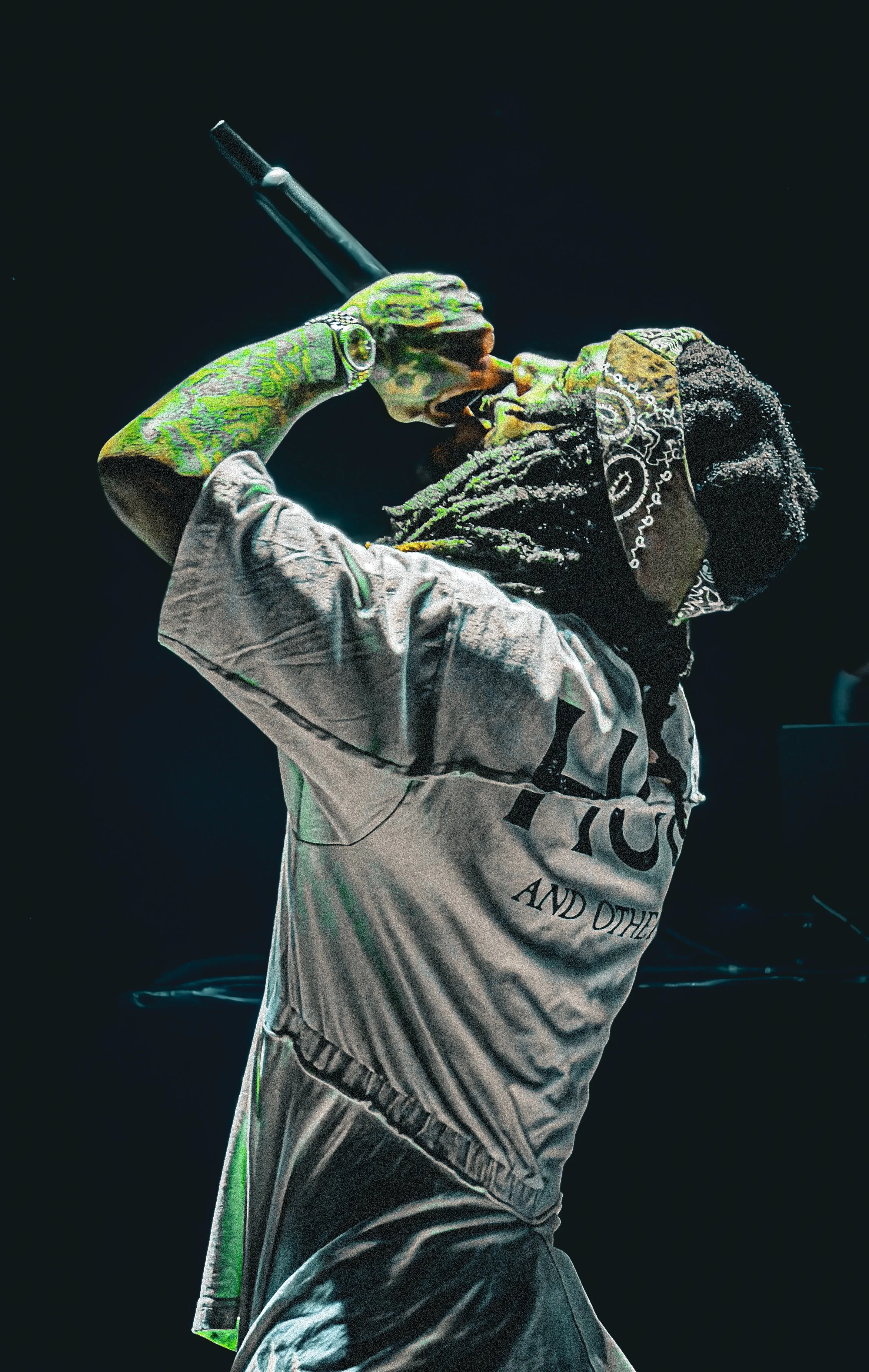 JID concert close-up, tattoos, mic raised.JPG