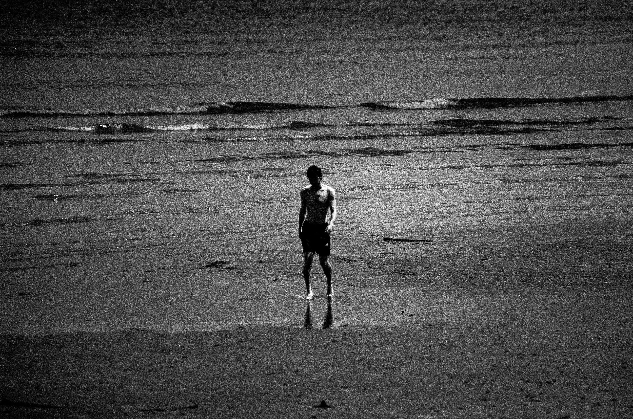 Lone figure on beach, B&W film.JPG