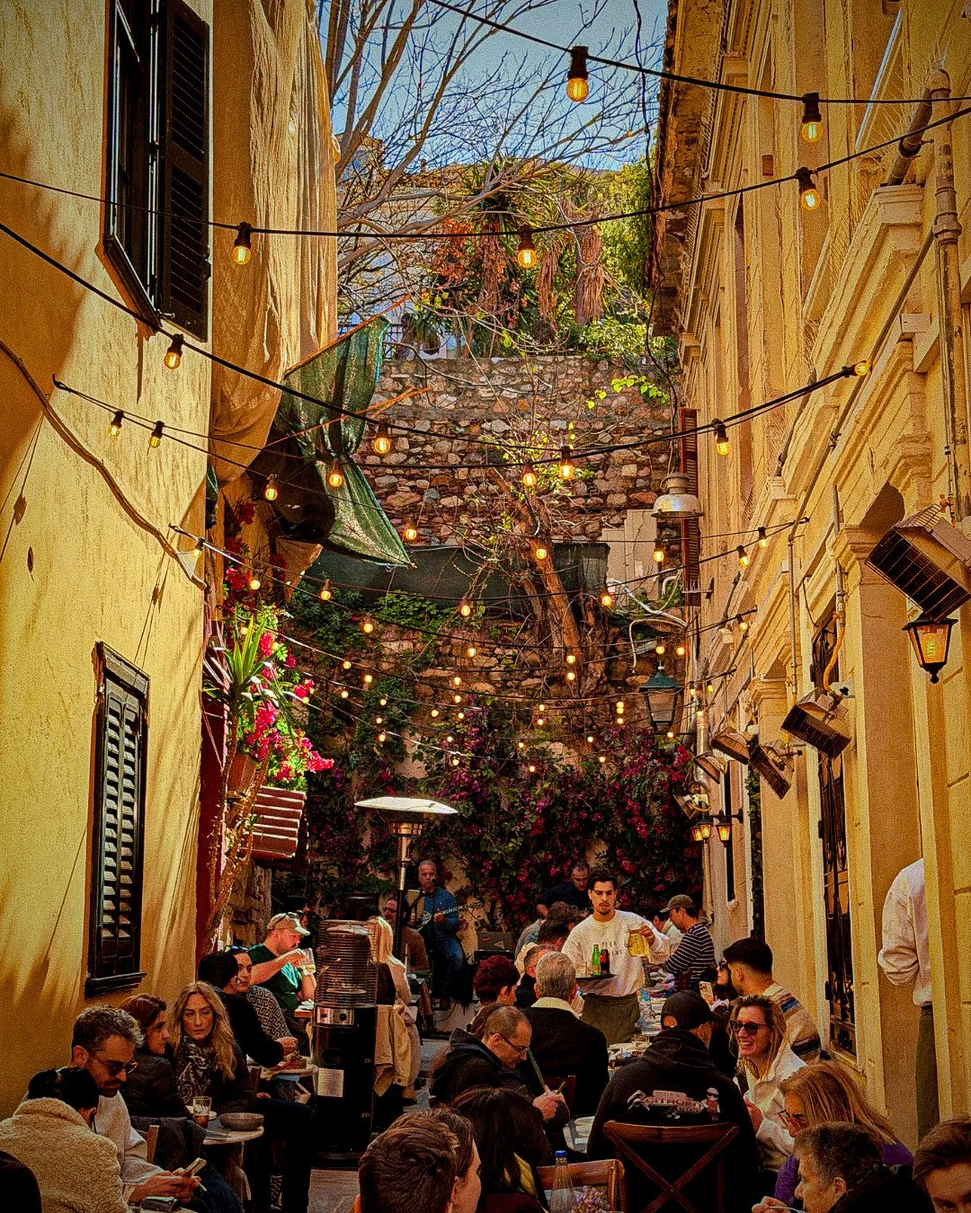 Lit alleyway restaurant, warm and alive.jpg
