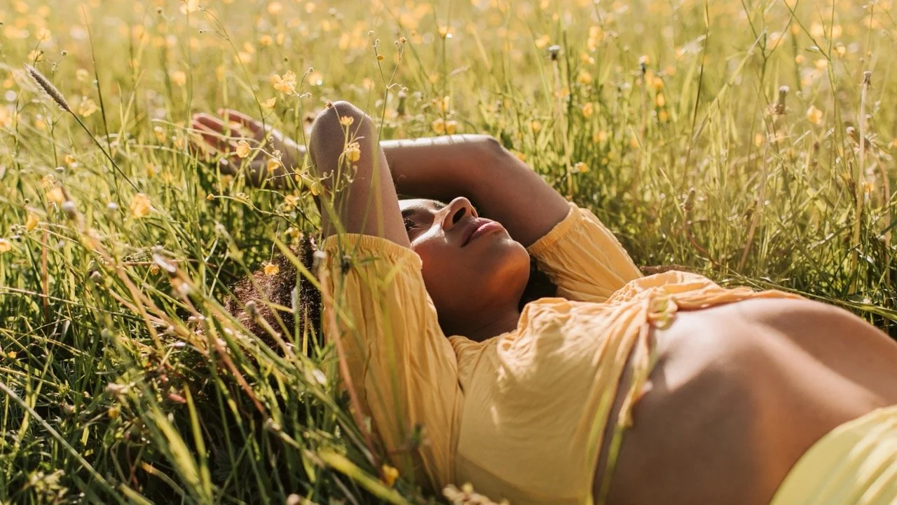 african-american-woman-in-field-of-yellow-flowers