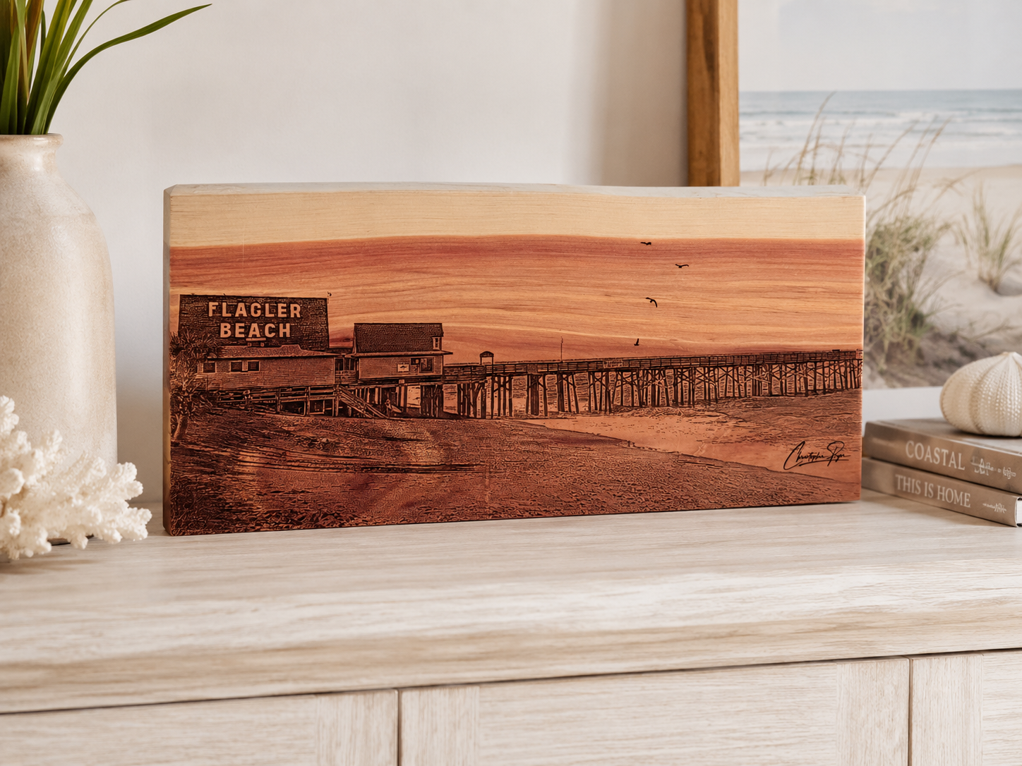 Flagler Beach Pier laser-engraved on cedar wood and displayed on a side table in a home.