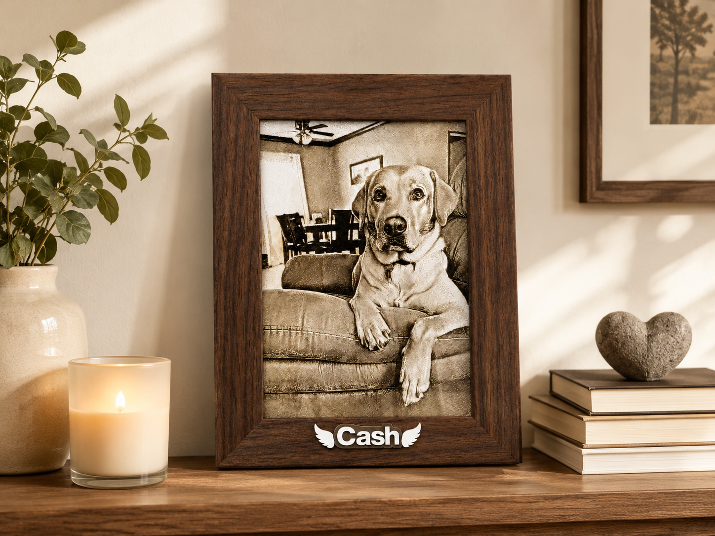 Framed laser-engraved portrait of Cash, a dog, displayed on a table in a home.