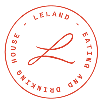 Circle logo with a large red 'L' in the center, surrounded by the words 'LELAND,' 'EATING,' 'AND,' 'DRINKING,' and 'HOUSE' in red capital letters.