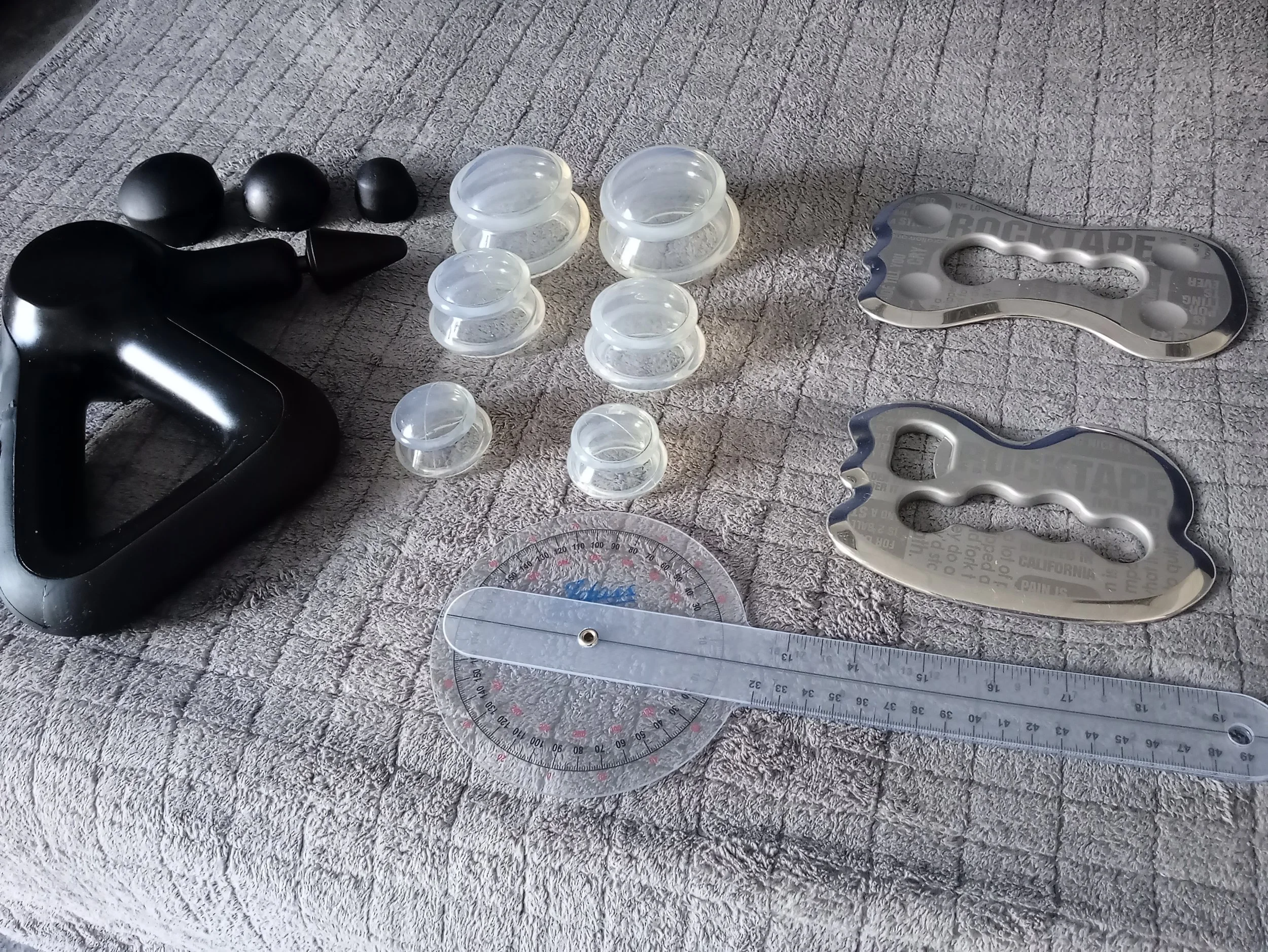 image showing tools and techniques ross can use during massage session depending on client needs or wants from cupping scrapping to the massage gun