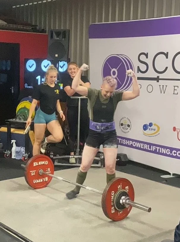 paula celebrating after deadlift at powerlifting competition in Paisley