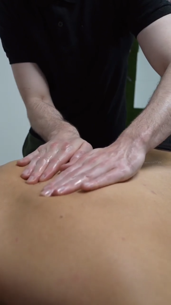 image showing deep tissue massage on upper back by msk therapist in east kilbride