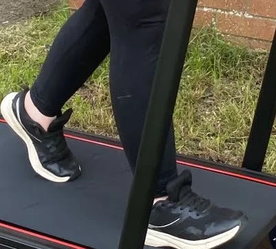 Feet moving on a treadmill