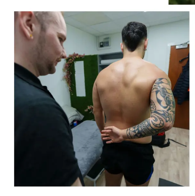 sports/msk therapist performing mobility test on client for movement support