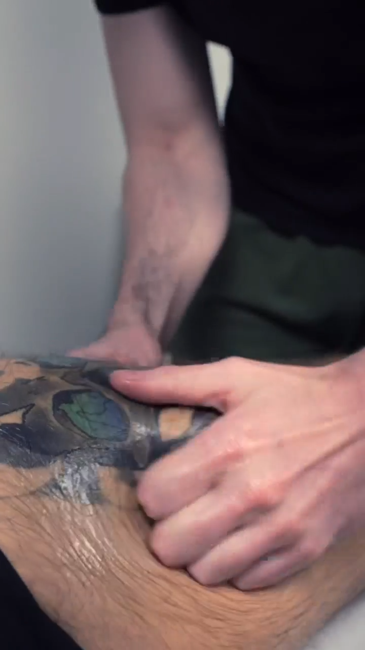 image of deep tissue treatment on males leg