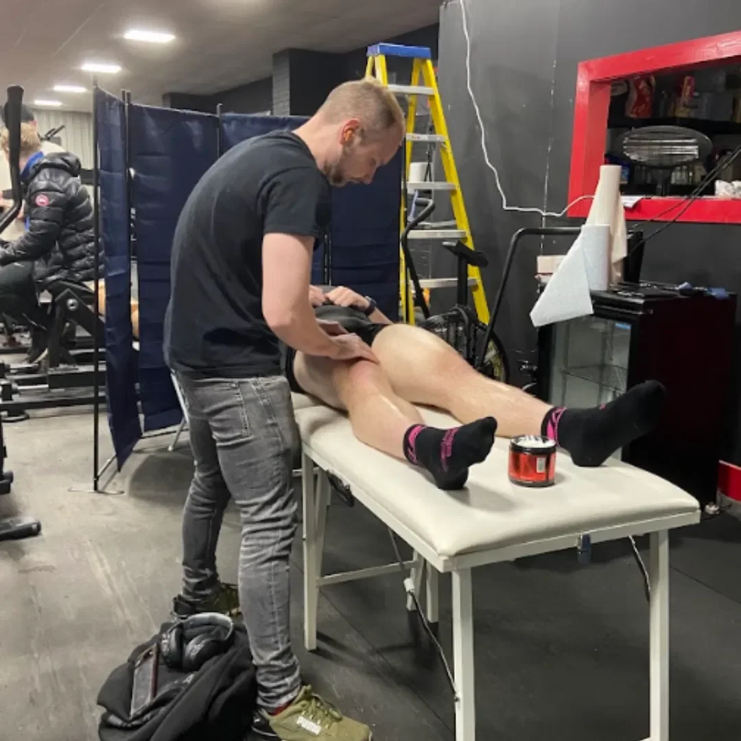 Ross providing Sports Massage at a powerlifting competition.