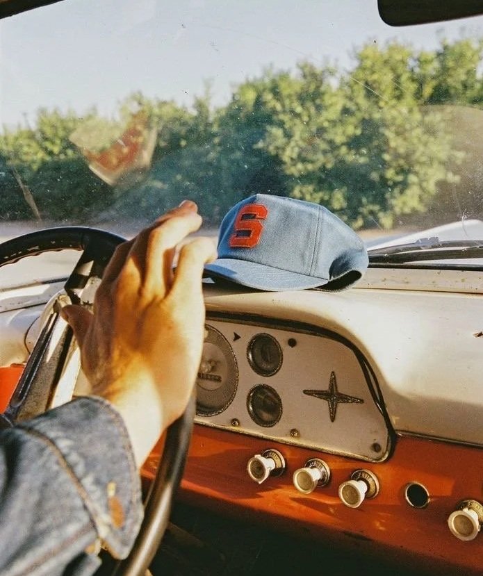hand on a steering wheel, denver waxing