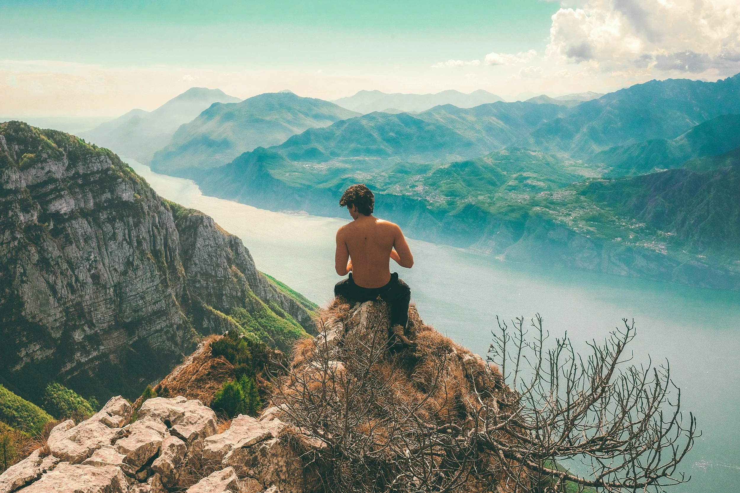 shirtless man on mountain