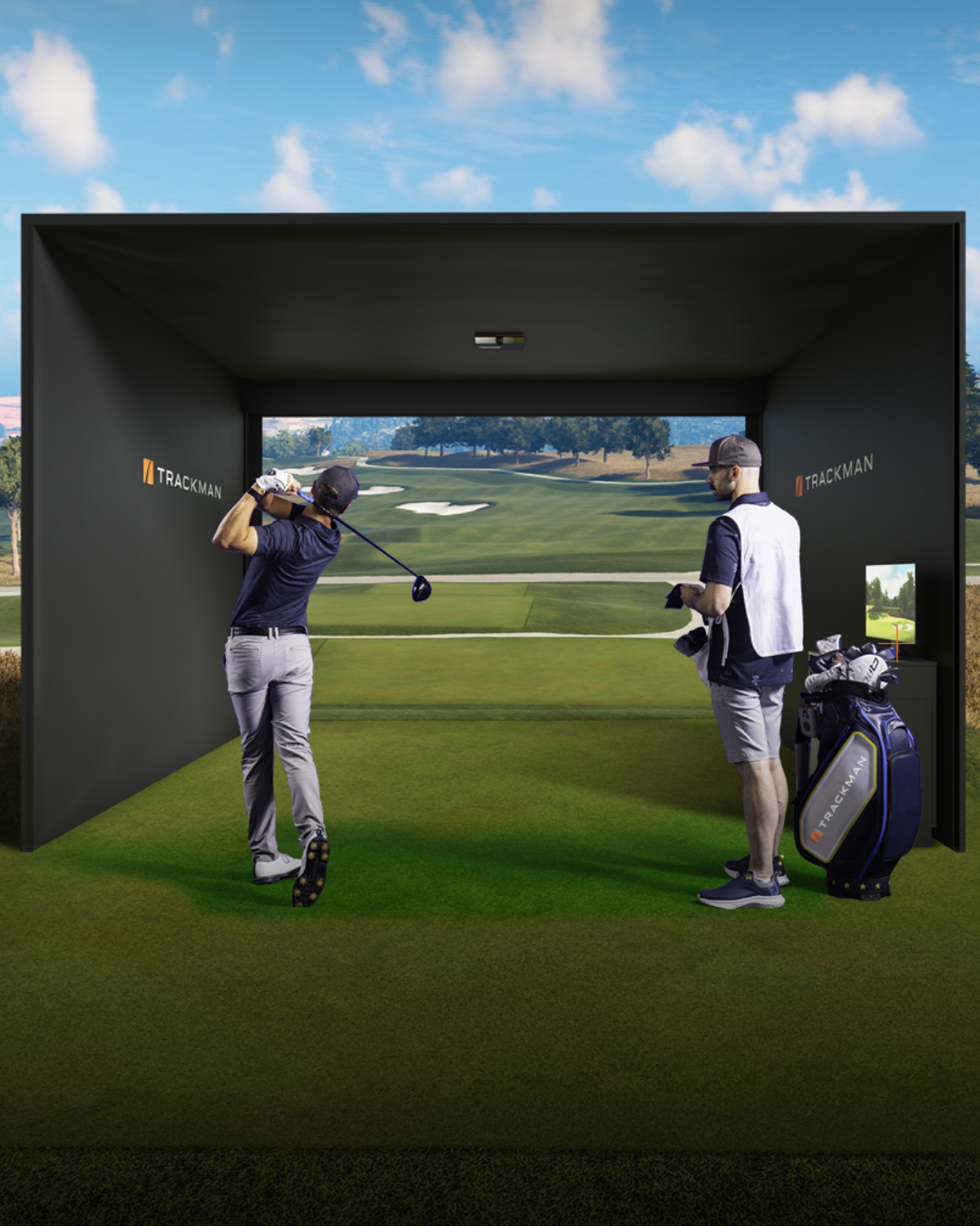 People practicing golf in an indoor simulator room with a large screen displaying a golf course, golf clubs, and a golf bag.