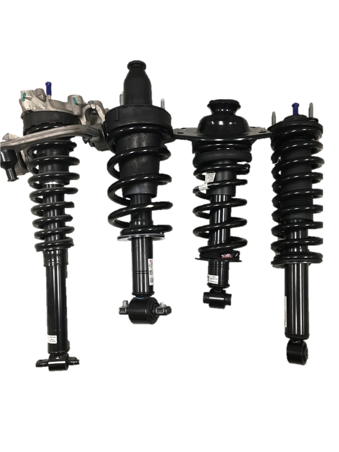 Set of four automotive suspension struts with coil springs, black in color, displayed against a plain background.
