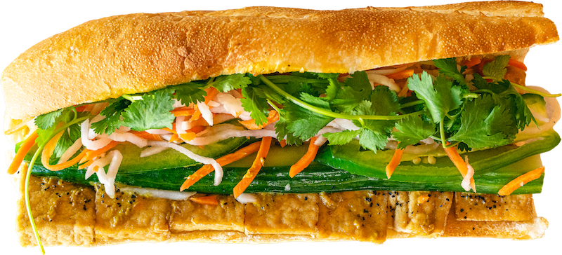 Close-up of Curry Tofu Banh Mi Boy sandwich.
