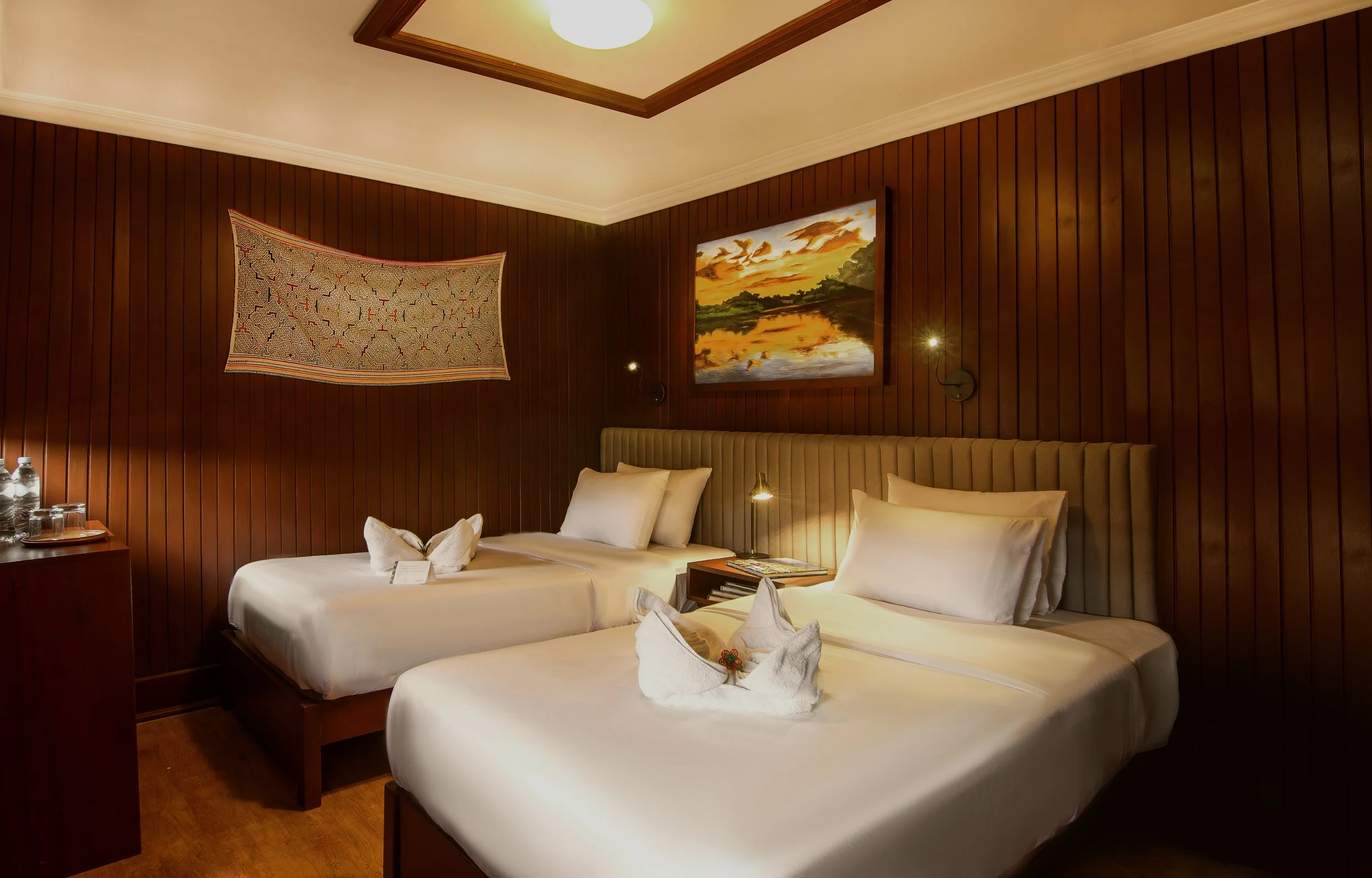 Acrylic painting displayed in a hotel cabin from a series of fourteen commissioned artworks created for Amatista, a Jungle Experiences Amazon cruise vessel, inspired by the flora and fauna of the Peruvian Amazon.