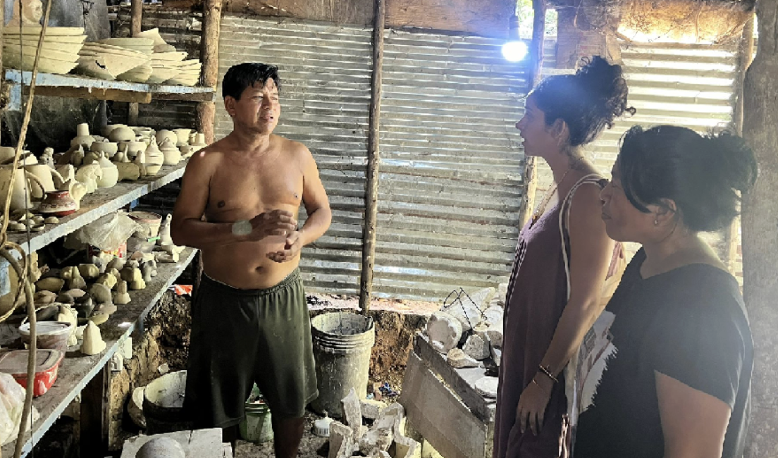 Valeria R.O. visiting a traditional ceramic workshop and speaking with local artisans during the artistic research process for the Mocahuitas Workshop