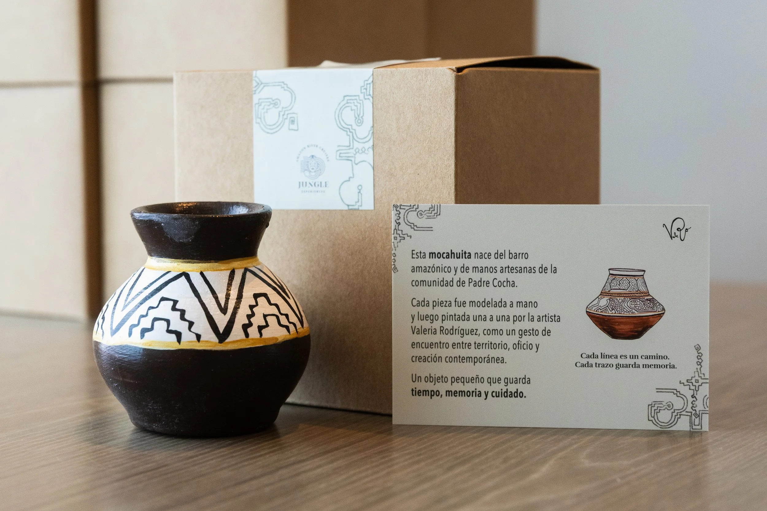 Hand-built ceramic vessel presented in a Mocahuita gift box, created as a corporate gift for Jungle Experiences and featuring organic sculptural forms with carved surface patterns inspired by traditional Amazonian kené designs.